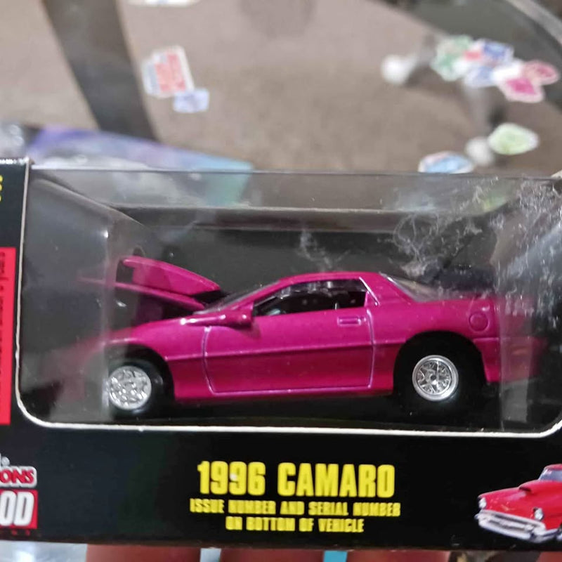 1996 Camaro magenta diecast model car with chrome wheels in display box