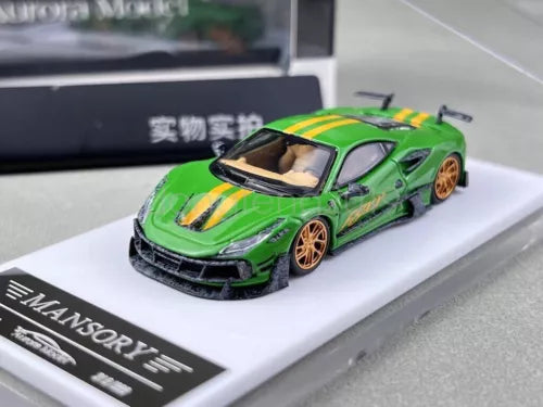 Green diecast sports car model with black front splitter on white display base, front 3/4 view