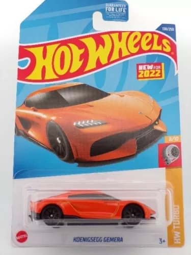 Orange Koenigsegg Gemera diecast model car with black accents, Hot Wheels style