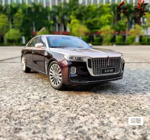 1:18 diecast model car, dark maroon front three-quarter view with grille and headlights