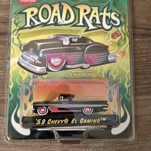 Diecast model car with black body, red flame graphics, chrome front, in Road Rats blister