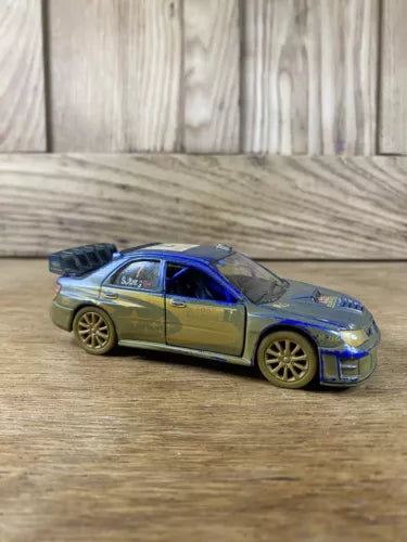 Blue and silver die-cast toy rally car with pull-back action