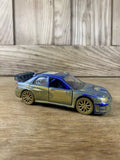 Blue and silver die-cast toy rally car with pull-back action