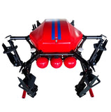 Red multi-rotor drone with four arms and propellers, blue stripe panel and front lights