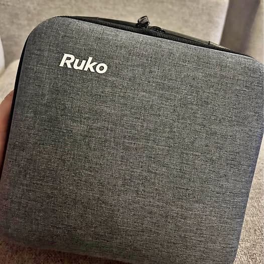 Gray zippered drone carrying case with Ruko logo on front