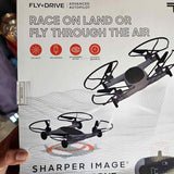 Black quadcopter drone with four propellers, on product packaging