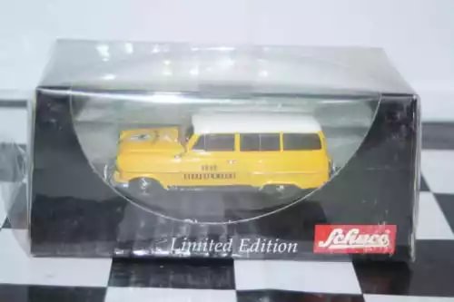 Yellow diecast caravan model in box with limited edition badge
