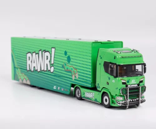 Green diecast truck model with enclosed cargo trailer and Scania cab, front 3/4