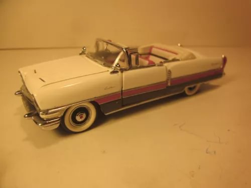 Cream convertible diecast model car with side view, whitewall tires