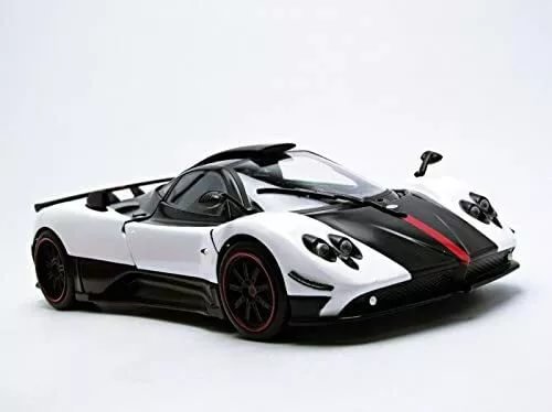White and black diecast sports car model with red stripes, front three-quarter view