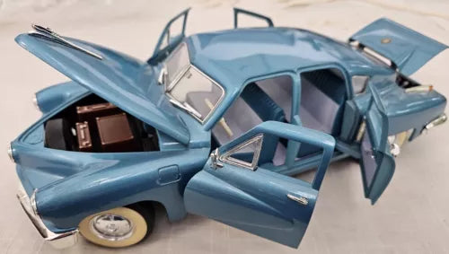 1/18 diecast car with open doors, light blue body, visible interior