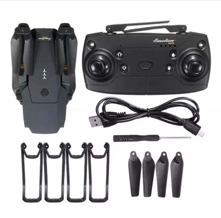 FPV drone kit with controller, propellers, and USB charging cable