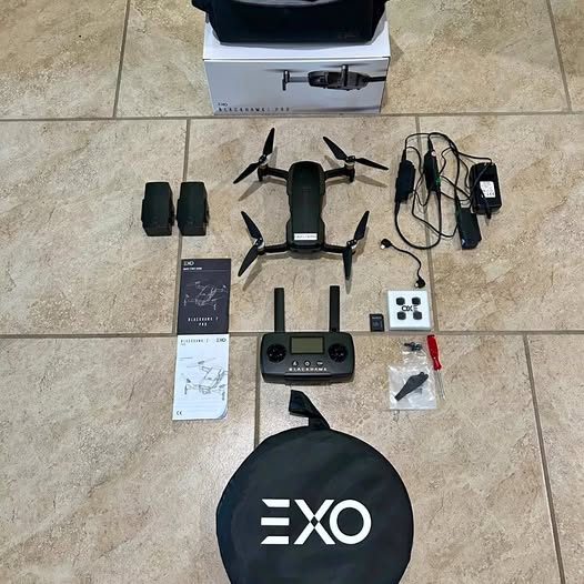 Professional 4K drone kit with controller, spare batteries, charger, and propellers