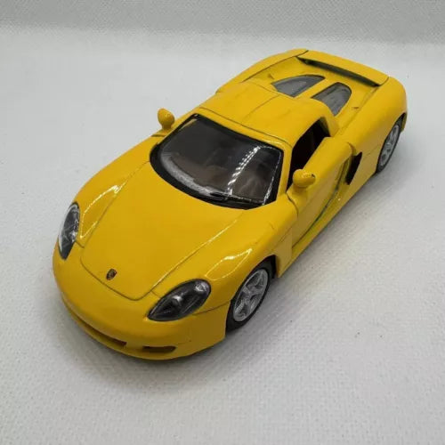 Yellow diecast Porsche Carrera GT model car toy, front three-quarter view