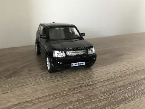 Black diecast SUV car model with front grille and headlights visible