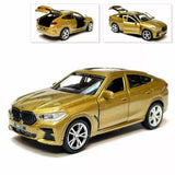 BMW X6 gold diecast model car, front three-quarter view, 1/36 scale