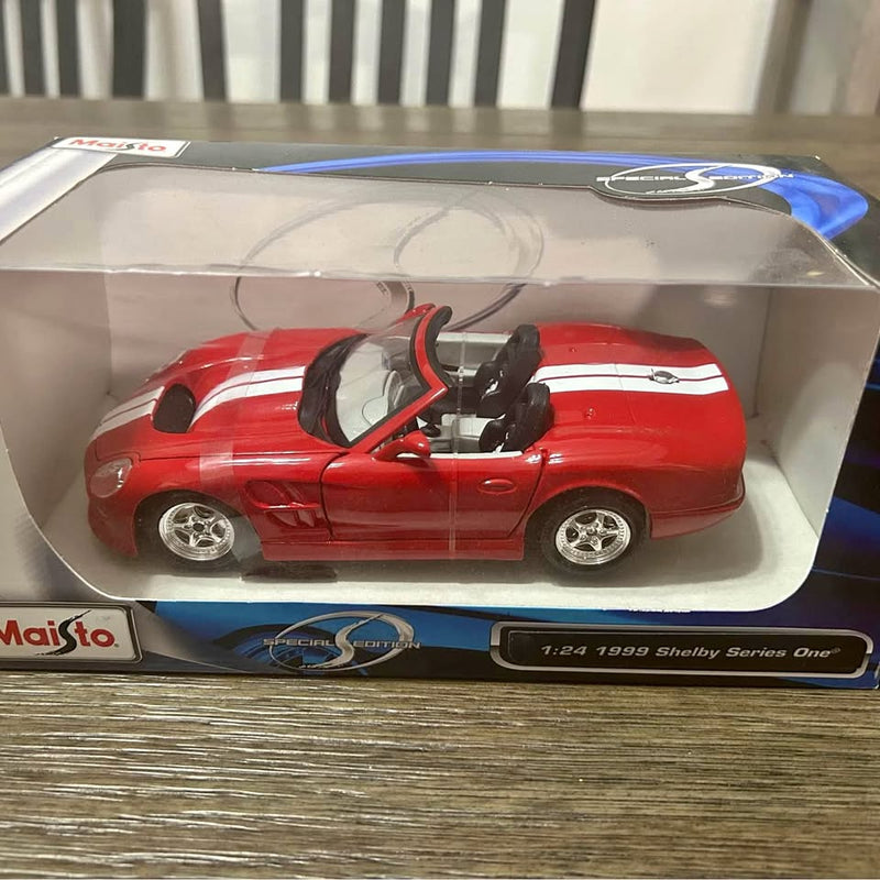 1:24 1999 Shelby Series One diecast metal car, red open-top convertible in box