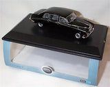 Black diecast model car with display base, boxed