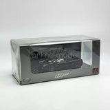 1/64 scale black diecast car model in display box with clear window