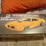 Diecast 1970 Pontiac GTO Judge car model, yellow with black details on box