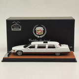 1/64 Cadillac Fleetwood white diecast model car on display base, black stand
