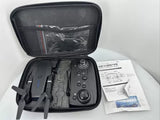 Folding drone in hard protective case with controller and manuals