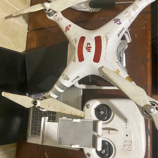 White quadcopter drone with dual front cameras and four propellers