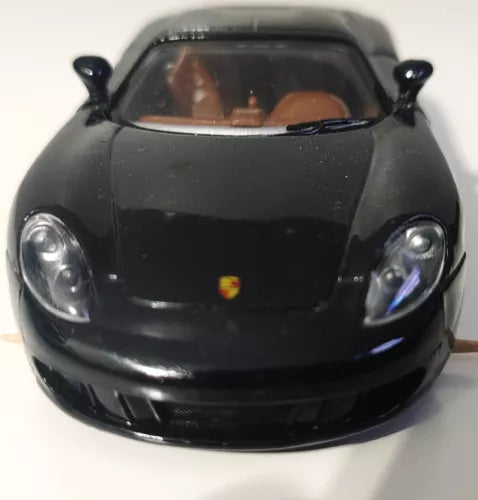 Black 1:36 scale diecast toy car front view with clear windshield