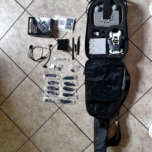 DJI Mini 4 Pro drone accessory bundle with carrying case and batteries