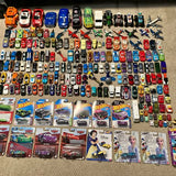 Hot Wheels and Disney Pixar Cars diecast toy lot with many small cars and character cards