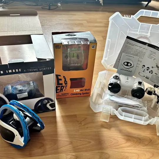 Drone and robot lot with boxed units, controller, and accessories