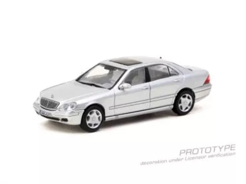 Brilliant silver 1:64 diecast model car with four doors and detailed wheels