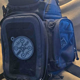 Blue tactical sling crossbody bag with front zip pocket and logo patch