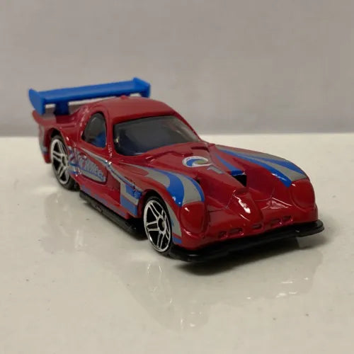 Red and blue racing diecast model car with rear spoiler and hood stripes