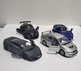 Diecast pull-back toy cars assortment in black, blue, and silver, front and side views