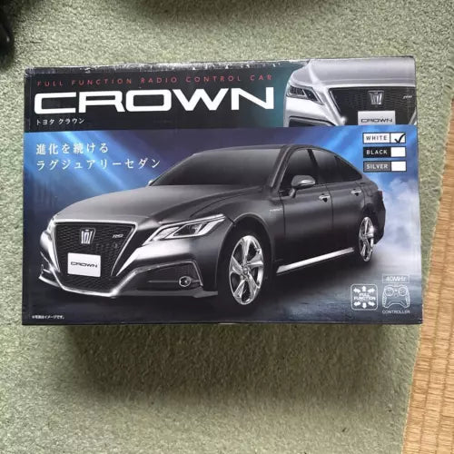 Black metal diecast sedan model car with front 3/4 view in retail box