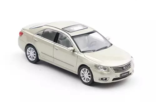 Silver diecast sedan model car, front 3/4 view with alloy wheels and sunroof