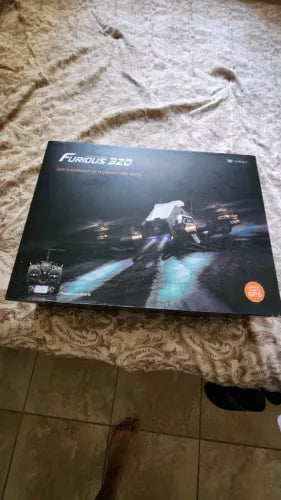 FPV racing drone product box with drone illustration and night city lights