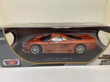 Orange diecast model car in open display box with clear window