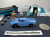 Blue vintage diecast toy car with open top and small figurines display