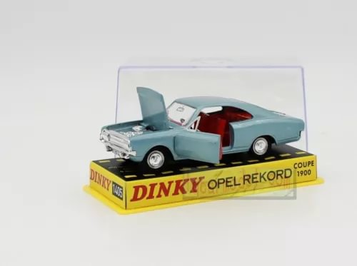 Mint green diecast coupe model car with open hood on Dinky base