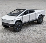 Diecast toy pickup truck model with angular silver body and black off-road wheels