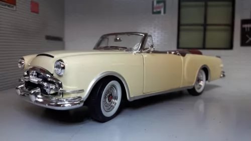 Cream open-top convertible diecast car model, 1:24 scale, chrome front details