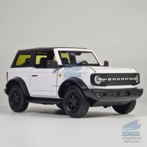 White alloy diecast 2-door off-road model car with black wheels and grille