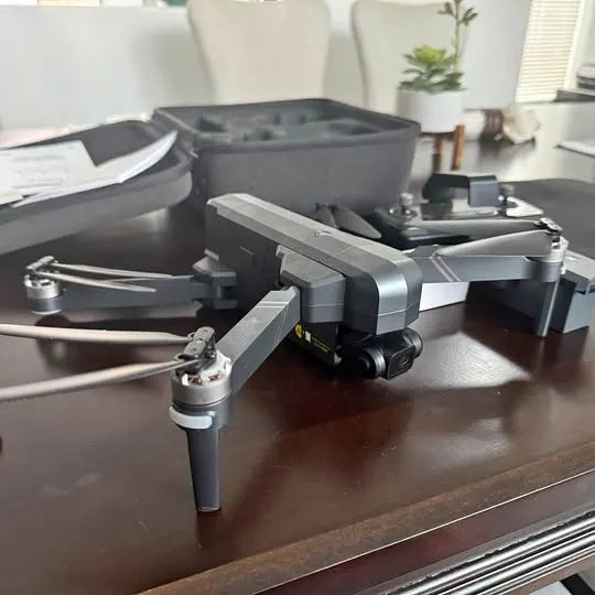 Gray folding quadcopter drone with four propellers
