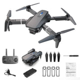 Foldable RC quadcopter drone with four propellers and dual camera, dark gray.