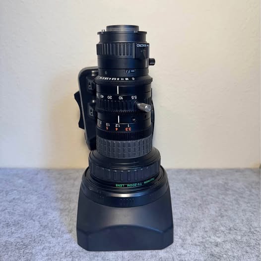 Fujinon broadcast zoom lens, black metal body with zoom and focus rings