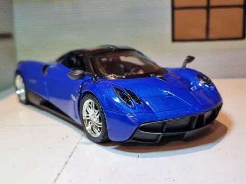 Blue supercar diecast model car, 1:24 scale, front three-quarter view