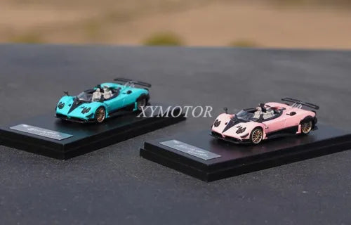 1:64 metal diecast model cars, teal and pink sports cars on display bases