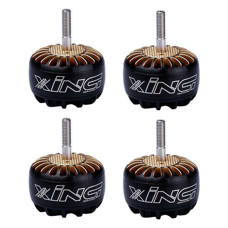 RC brushless motors, black with gold stator and silver shaft, four-pack view